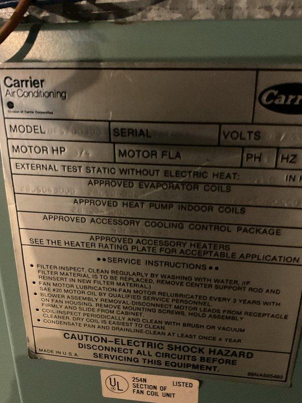 Conducted comprehensive assessment of existing Carrier air conditioning system for replacement estimate. Documented current equipment specifications from unit nameplate and photographed outdoor condenser unit positioned on concrete pad with burgundy cylindrical casing. Provided customer with detailed replacement options and pricing for new HVAC system installation.