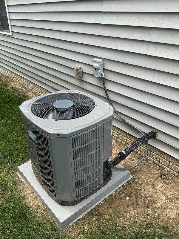 Completed comprehensive air conditioning tune-up on 7-year-old residential cooling system. Performed standard maintenance procedures including inspection of outdoor condenser unit, verification of refrigerant line connections, electrical disconnect box examination, and assessment of indoor furnace/air handler components. All equipment found operating within normal parameters with no deficiencies noted at time of service.