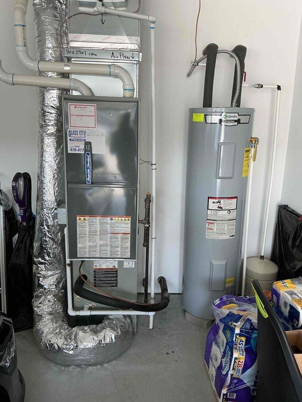 Completed comprehensive air conditioning tune-up on 7-year-old residential cooling system. Performed standard maintenance procedures including inspection of outdoor condenser unit, verification of refrigerant line connections, electrical disconnect box examination, and assessment of indoor furnace/air handler components. All equipment found operating within normal parameters with no deficiencies noted at time of service.