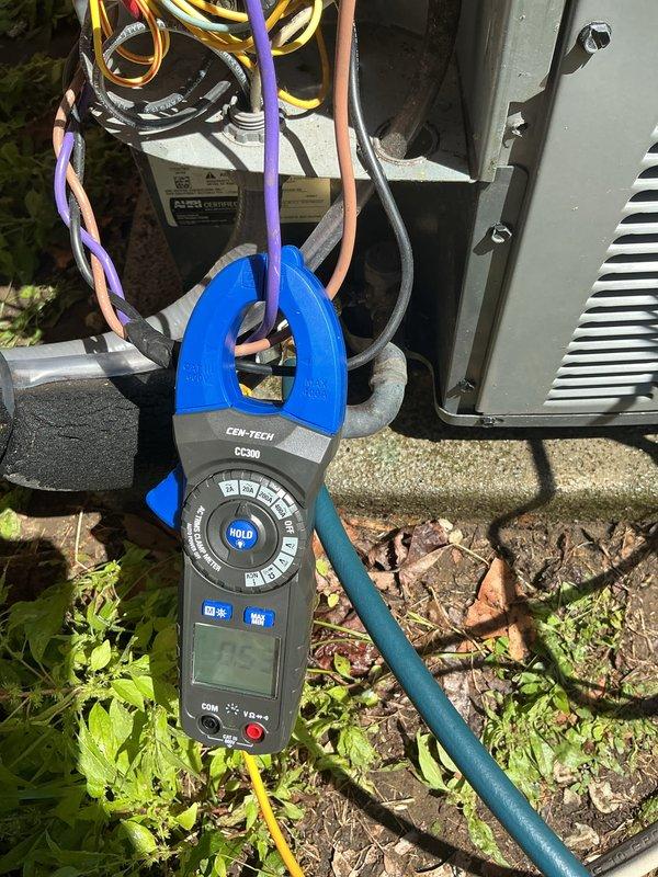 Completed routine cooling maintenance visit on 10-year-old air conditioning system. Performed comprehensive system inspection including electrical diagnostics with clamp meter to verify proper amperage draw and component function. Inspected compressor, capacitor, and electrical connections. Removed top panel to access internal components, checked compressor operation, verified fan motor assembly, and inspected refrigerant lines for proper connection and condition. System tested and operating within normal parameters upon completion.