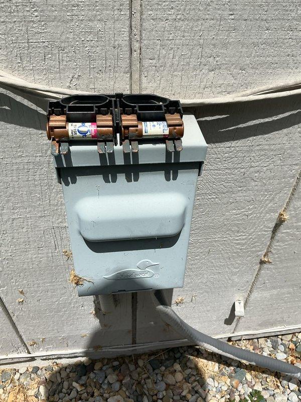 Completed routine cooling maintenance on a 15-year-old Goodman air conditioning system. Performed visual inspection of outdoor condensing unit, verified electrical disconnect operation, and assessed condenser coil condition. Unit operational at time of service with documentation photos taken of equipment nameplate and electrical components.