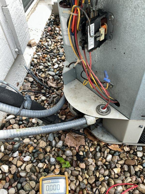 # HVAC Tune-Up Completed

Performed comprehensive tune-up on 15-year-old air conditioning system. Conducted electrical diagnostics using digital multimeter and clamp meter to verify proper component operation. Measured amp draw on compressor circuit, recording 4.12 amps, which falls within acceptable operating range for the unit. Tested capacitor connections and verified proper voltage across all electrical terminals. Inspected outdoor condensing unit including all wiring connections, relay components, and refrigerant line sets. All wire connections were secure with proper wire nuts installed on control wiring. Checked equipment mounting and confirmed unit is stable on pad with adequate clearance. Refrigerant lines showed no visible signs of damage or wear. System tested and operating normally with all electrical readings within manufacturer specifications.