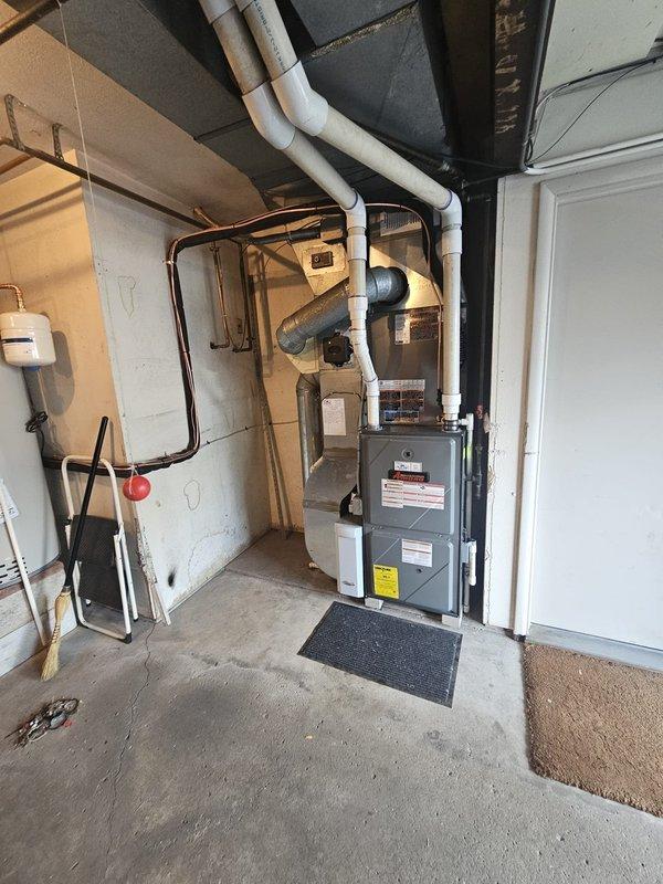 Completed installation of a 3-ton, 13 SEER single-stage air conditioning system with matching upflow coil in residential basement mechanical room. Installed new 3/4-inch line set with 40-foot run connecting indoor coil to outdoor condenser unit, mounted new condenser on concrete pad with proper clearances, and installed new electrical disconnect and whip for code compliance. Fabricated plenum connections for coil integration with existing furnace, installed metal 12-gallon humidifier, replaced thermostat with new unit, and verified all refrigerant lines properly insulated and sealed. System startup completed with refrigerant charge verified, airflow tested across coil, and all electrical connections inspected for proper voltage and amperage.
