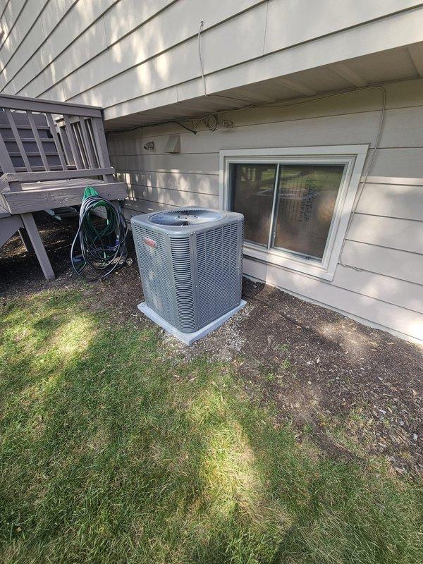 Completed installation of a 3-ton, 13 SEER single-stage air conditioning system with matching upflow coil in residential basement mechanical room. Installed new 3/4-inch line set with 40-foot run connecting indoor coil to outdoor condenser unit, mounted new condenser on concrete pad with proper clearances, and installed new electrical disconnect and whip for code compliance. Fabricated plenum connections for coil integration with existing furnace, installed metal 12-gallon humidifier, replaced thermostat with new unit, and verified all refrigerant lines properly insulated and sealed. System startup completed with refrigerant charge verified, airflow tested across coil, and all electrical connections inspected for proper voltage and amperage.