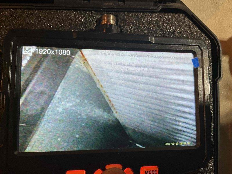 Completed scheduled heating system maintenance on furnace unit. Performed thorough inspection of heat exchanger and internal components using borescope camera to verify integrity and identify any potential issues. Examined evaporator coil assembly, copper refrigerant lines, and associated connections for signs of wear, corrosion, or leaks. Noted dust accumulation on coil surfaces and oxidation present on copper tubing connections, consistent with normal aging of equipment. All components found to be functioning properly with no immediate repairs required. System operational and ready for continued service.