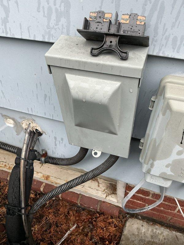 Completed scheduled maintenance on 8-year-old air conditioning system. Inspected outdoor condensing unit, electrical disconnect, and contactors, noting weathered conduit connections and significant lint/debris accumulation around interior fan compartment. Cleaned unit, verified proper operation of all components, and ensured system is ready for continued service.