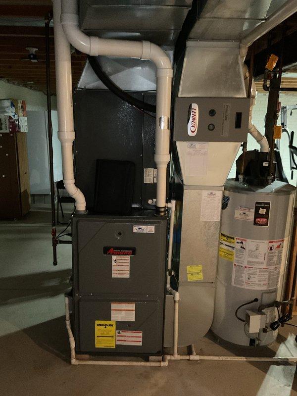 Completed confirmed air conditioning maintenance service call on residential HVAC system. Inspected and serviced Amana outdoor condenser unit and Lennox indoor air handler with furnace assembly, verifying proper operation of all cooling system components. All equipment found to be functioning correctly with no issues requiring repair at this time.