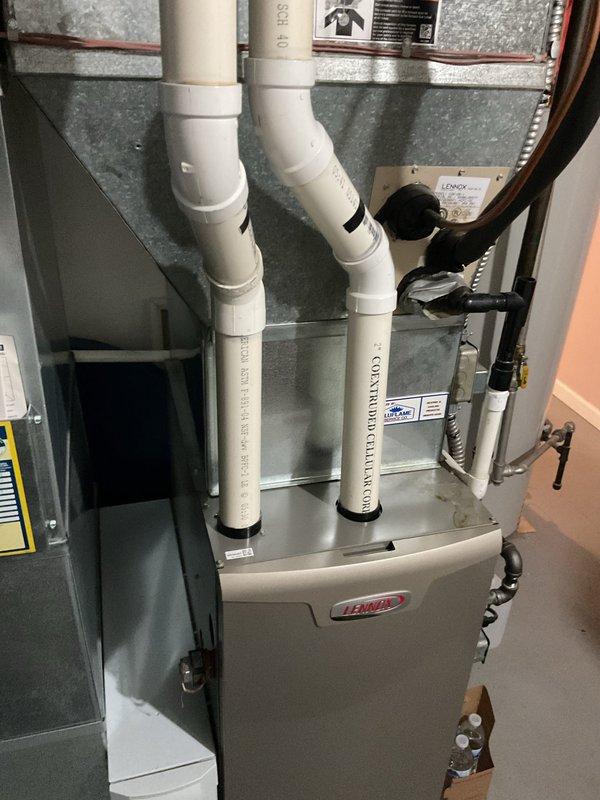 Provided comprehensive estimate for complete HVAC system replacement including existing Lennox furnace and outdoor AC condenser unit. Assessment covered removal of current equipment, installation of new high-efficiency system, electrical disconnect modifications, proper venting configuration with PVC intake/exhaust pipes, ductwork connections, condensate drainage, and concrete pad placement for outdoor unit.