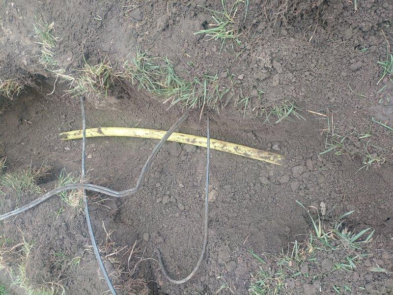 Responded to gas line repair request for exterior gas piping system. Upon inspection, identified weathered and deteriorated yellow-coated gas line showing significant surface wear, paint degradation, and exposure damage. Excavated affected section of gas line, removed compromised piping material, and installed replacement gas line section to restore system integrity. Performed pressure test on repaired gas line to verify leak-free connections and proper system operation, confirming all readings met code requirements for safe gas delivery.