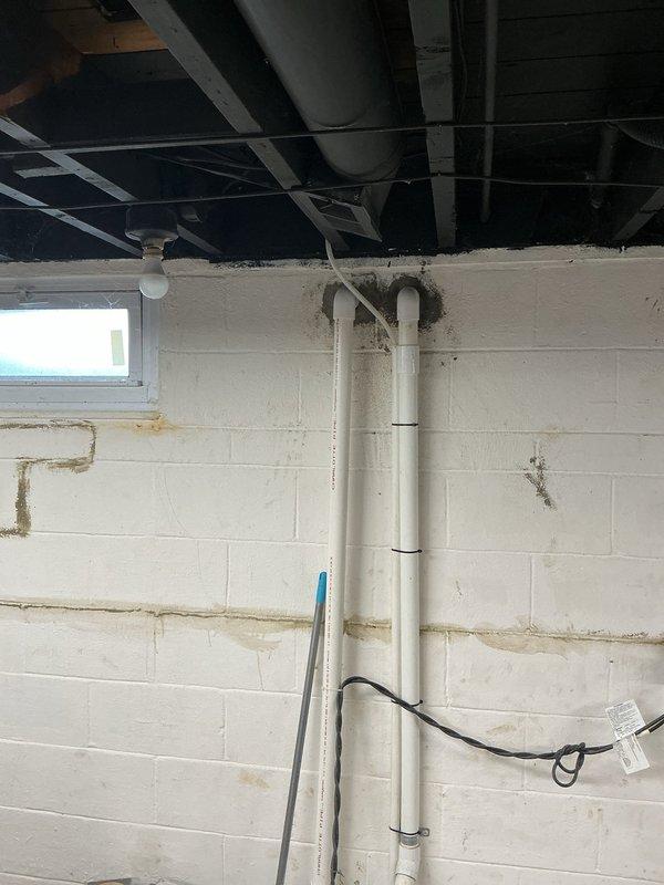 Completed full HVAC system installation including new condenser unit, evaporator coil, and 30-foot refrigerant lineset. Installed ground pad for outdoor condenser placement, 30-amp electrical disconnect with whips for proper power supply and code compliance. System was properly mounted in basement location with all electrical connections secured, refrigerant lines routed and insulated, and condensate drainage integrated with existing PVC piping infrastructure. All components tested and verified operational upon completion.