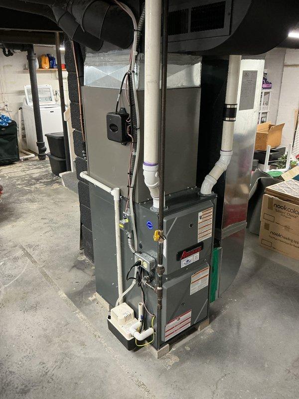 Completed full HVAC system installation including new condenser unit, evaporator coil, and 30-foot refrigerant lineset. Installed ground pad for outdoor condenser placement, 30-amp electrical disconnect with whips for proper power supply and code compliance. System was properly mounted in basement location with all electrical connections secured, refrigerant lines routed and insulated, and condensate drainage integrated with existing PVC piping infrastructure. All components tested and verified operational upon completion.