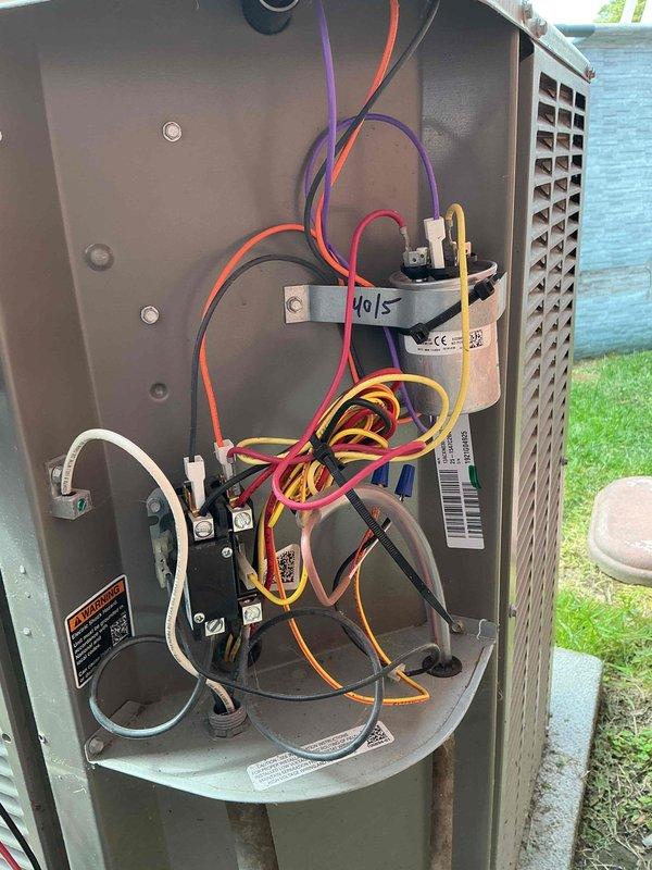 Performed comprehensive tune-up on 4-year-old Lennox residential air conditioning system. Inspected electrical components including capacitor (40/5 MFD), contactor relay, and associated wiring connections; verified proper operation of condenser unit and fan assembly. All components found in good working condition with no deficiencies noted.