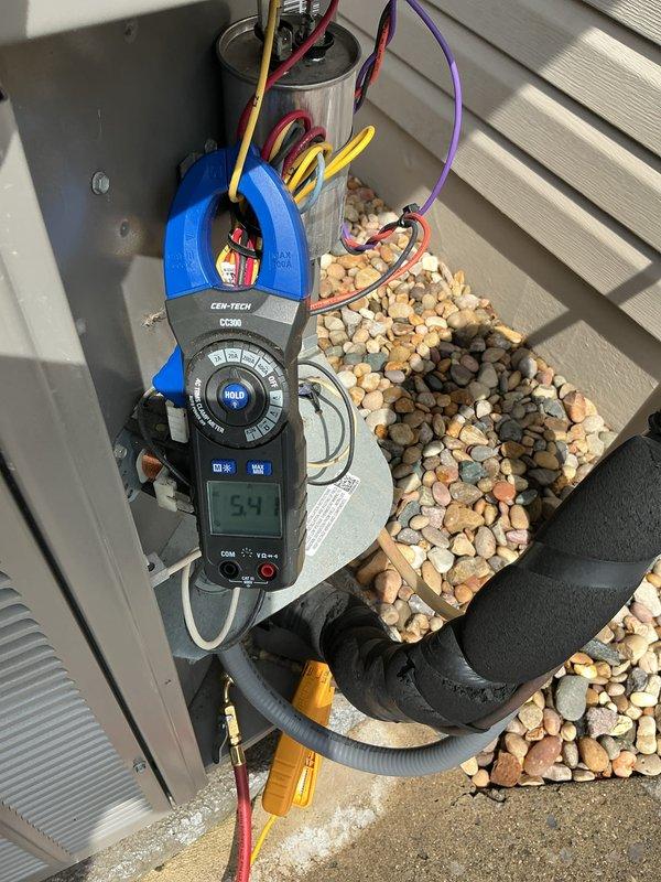 Completed comprehensive tune-up on 4-year-old outdoor HVAC unit. Performed electrical diagnostics using clamp meter, recording amperage readings at 54.1 amps to verify compressor performance within manufacturer specifications. Inspected condenser coils, capacitor connections, and all electrical components for proper operation and wear. Unit found to be functioning properly with no issues identified during inspection.