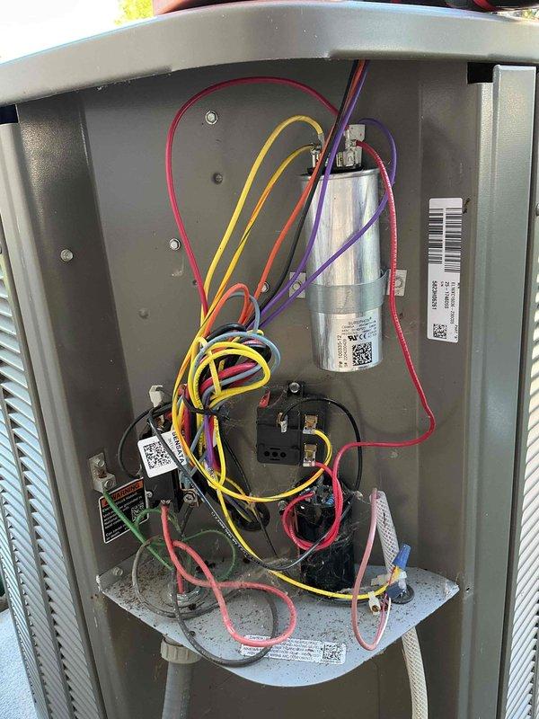 Completed comprehensive AC tune-up including inspection of electrical components, capacitor testing, and verification of all wire connections within the condensing unit. Documented SUREPHON CBB65A dual-run capacitor (440V, 45+5 MFD) and contactor assembly showing normal operating condition with all connections secure and system functioning properly.