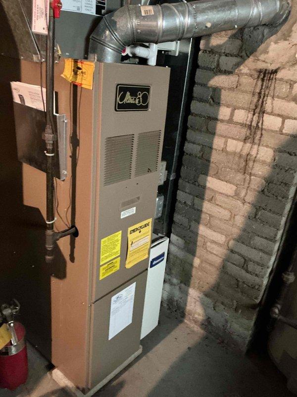 Completed routine maintenance inspection on residential Ultra 80 furnace and air conditioning system to maintain warranty compliance. Performed comprehensive tune-up including visual inspection of furnace cabinet, ductwork connections, electrical wiring and terminal connections, and control components. Both systems found operating within normal parameters with no deficiencies noted at time of service.