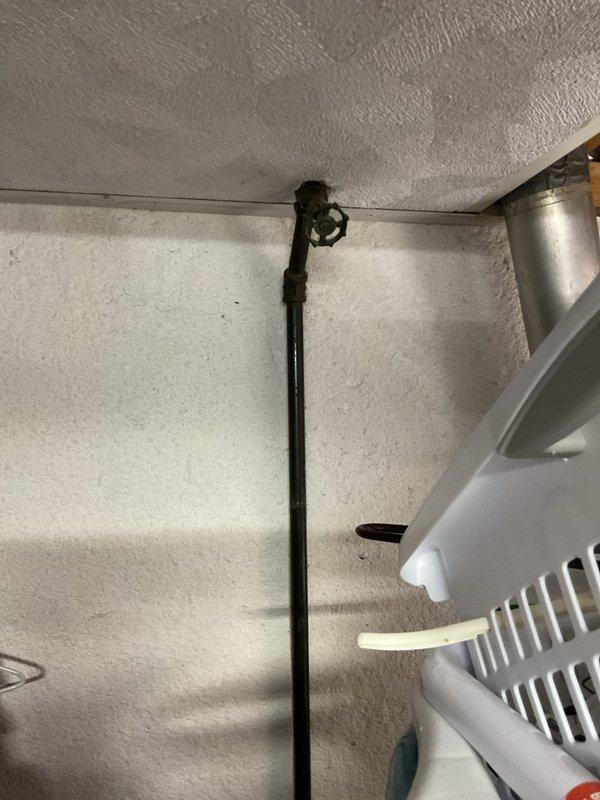 Completed comprehensive assessment of existing HVAC system and water heater for replacement estimate. Evaluated current furnace installation in utility room, including existing ductwork configuration, refrigerant lines, and condensate drainage system. Documented equipment specifications, spatial constraints, and necessary modifications for new equipment installation. Photographed vertical vent pipe routing through insulated space to assess proper venting requirements for replacement units. Provided detailed recommendations for furnace and water heater replacement, ensuring compliance with current code requirements and optimal system performance.