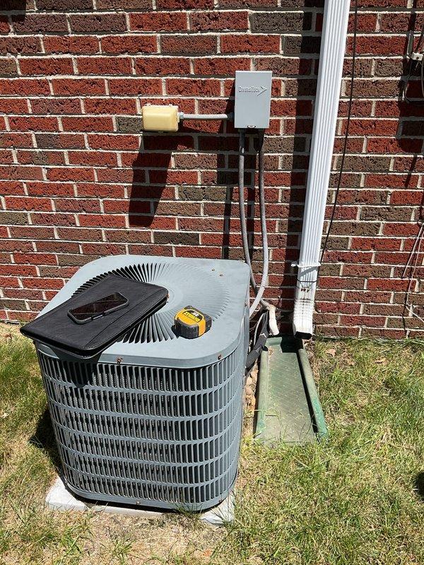 Conducted comprehensive assessment of existing HVAC system including indoor furnace unit and outdoor condensing unit to provide replacement estimate. Evaluated current Rheem-Ruud equipment configuration in utility closet, inspected ductwork connections, and assessed outdoor condenser unit condition along with associated electrical disconnect and condensate drainage system to determine replacement specifications and requirements.