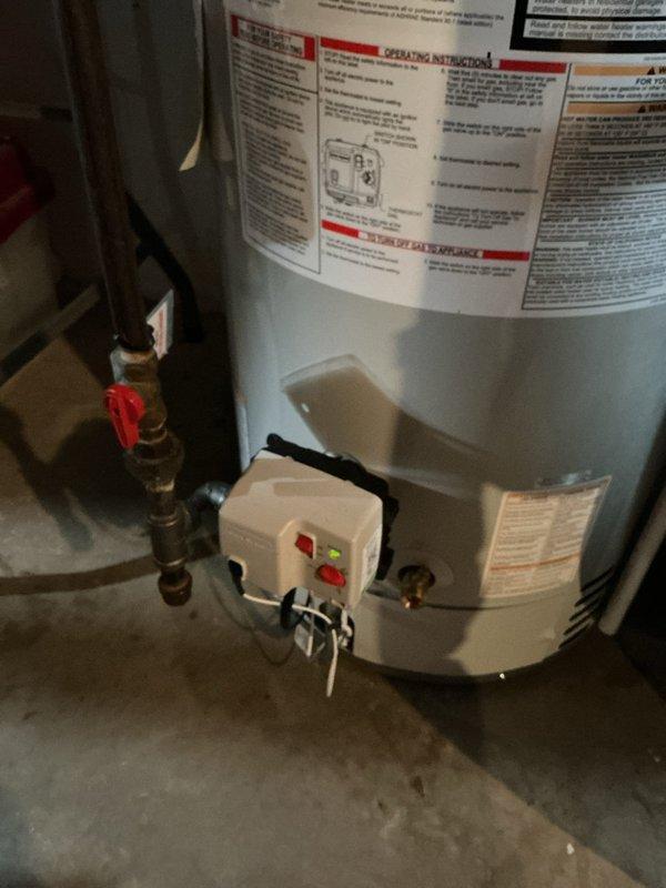 Installed 40-gallon power vent water heater in basement utility area. Connected copper supply lines with shutoff valves, routed PVC power vent piping through existing infrastructure, and installed temperature and pressure relief valve with proper discharge piping. Secured unit to manufacturer specifications, verified all connections for leaks, tested ignition sequence, and confirmed proper venting operation.