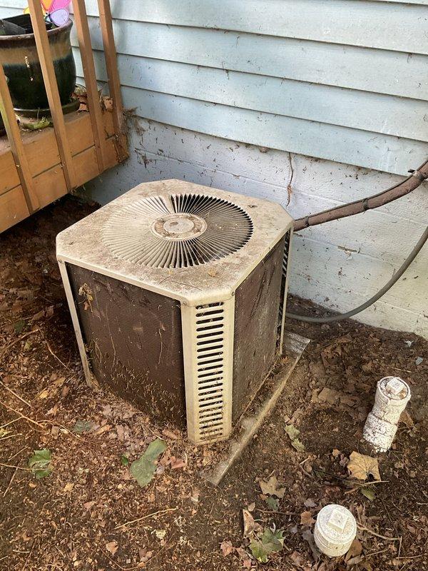 Conducted comprehensive assessment of existing HVAC system including basement-installed furnace and outdoor condensing unit to provide replacement estimate. Both units showed significant age and wear, with the outdoor condenser exhibiting substantial dirt accumulation, weathered surfaces, and debris buildup around the base. Documented current equipment specifications, photographed existing installations, and evaluated system configuration including venting, refrigerant line routing, and spatial constraints for replacement equipment recommendations.