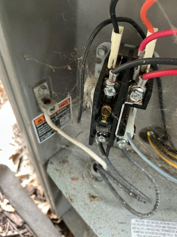 Completed preventative maintenance on 3-year-old air conditioning system. Inspected electrical connections at unit terminal blocks, noting accumulated dust and debris within panel housing. Performed amperage draw measurements using clamp meter, recording 5.9 amp reading on circuit. Cleaned electrical panel interior and connection points to ensure proper operation and prevent potential issues from environmental contamination.