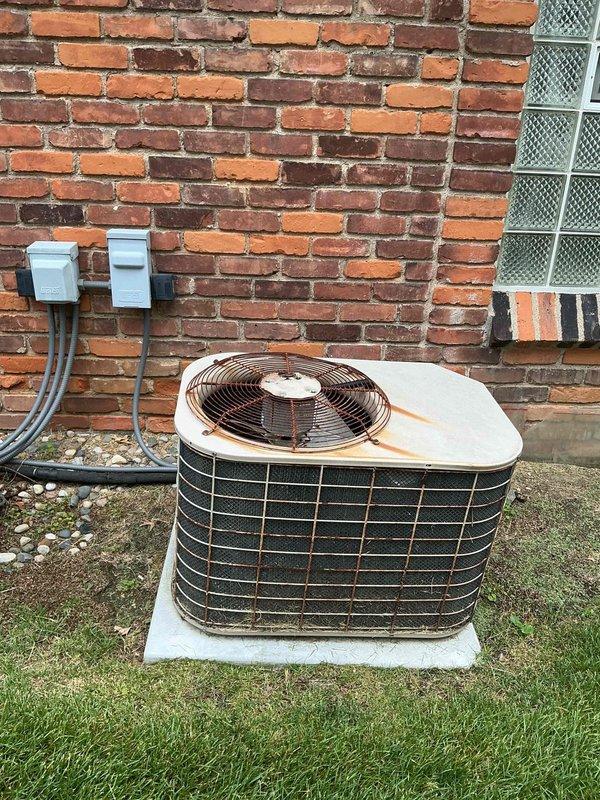 Completed preventive maintenance on two residential air conditioning systems, ages 10 and 12 years. Performed comprehensive tune-up procedures on both outdoor condenser units including inspection of electrical connections, refrigerant levels, and mechanical components. Both units showed signs of aging with visible rust staining on exterior panels but remained operational. Verified proper airflow through condenser coils, checked fan motor operation, and ensured all safety controls functioned correctly. Systems tested and left in normal operating condition.
