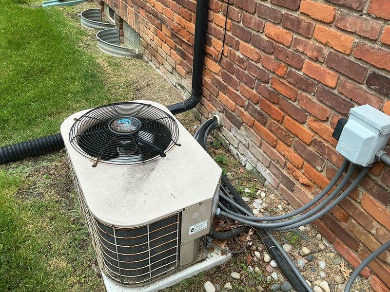 Completed preventive maintenance on two residential air conditioning systems, ages 10 and 12 years. Performed comprehensive tune-up procedures on both outdoor condenser units including inspection of electrical connections, refrigerant levels, and mechanical components. Both units showed signs of aging with visible rust staining on exterior panels but remained operational. Verified proper airflow through condenser coils, checked fan motor operation, and ensured all safety controls functioned correctly. Systems tested and left in normal operating condition.