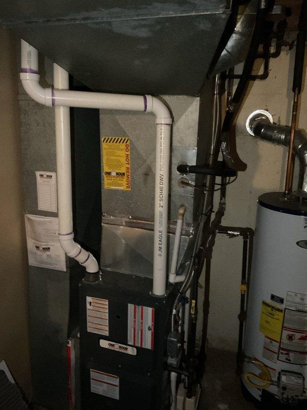 Completed comprehensive estimate for full HVAC system replacement at residential property. Assessed existing outdoor condensing unit showing significant age-related deterioration, surface discoloration, and weathering of cabinet exterior. Evaluated indoor furnace system located in basement mechanical room, noting current configuration with existing ductwork, venting system, and clearances. Documented refrigerant line set routing from outdoor unit through exterior wall penetration. Provided homeowner with equipment options and specifications for replacement air conditioning condenser and compatible system components to restore efficient cooling operation.