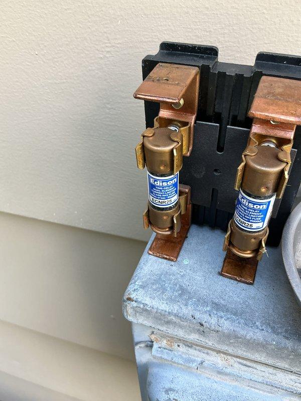 Completed seasonal air conditioning tune-up on a 6-year-old Amana condensing unit located on exterior concrete pad. Performed comprehensive maintenance inspection including evaluation of electrical disconnect with fused protection, verified proper clearances around equipment, and documented unit condition showing normal wear patterns consistent with age and outdoor exposure.