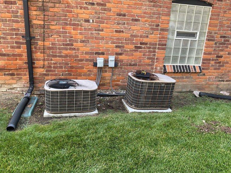 Conducted on-site assessment for mini-split HVAC system installation at residential property. Evaluated existing electrical infrastructure, including main breaker panel with available capacity for new system connection, and documented current outdoor HVAC equipment configuration consisting of two existing condenser units with refrigerant line sets and wall-mounted covers. Assessment included verification of suitable mounting locations, electrical service compatibility, and optimal placement for indoor and outdoor mini-split components to provide efficient heating and cooling solution.