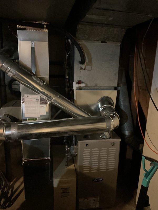 Provided estimate for replacement of right-side air conditioning condenser unit located at exterior of property against brick wall. Customer's existing condenser showing signs of age, and quote includes removal of current unit, installation of new condenser with proper refrigerant lines, electrical connections, and system testing to ensure proper operation with existing indoor Carrier furnace and air handler equipment.