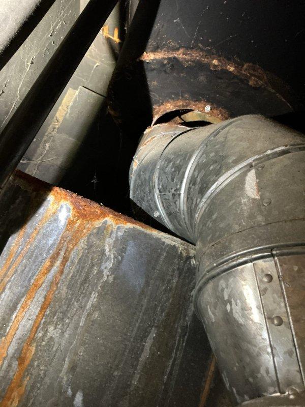 Performed preventative maintenance on residential air conditioning system. Accessed and thoroughly cleaned evaporator coil as requested to restore optimal heat transfer efficiency and airflow. Inspected ductwork and internal components, noting visible rust and corrosion on metal ductwork and structural supports indicating moisture exposure and age-related deterioration.