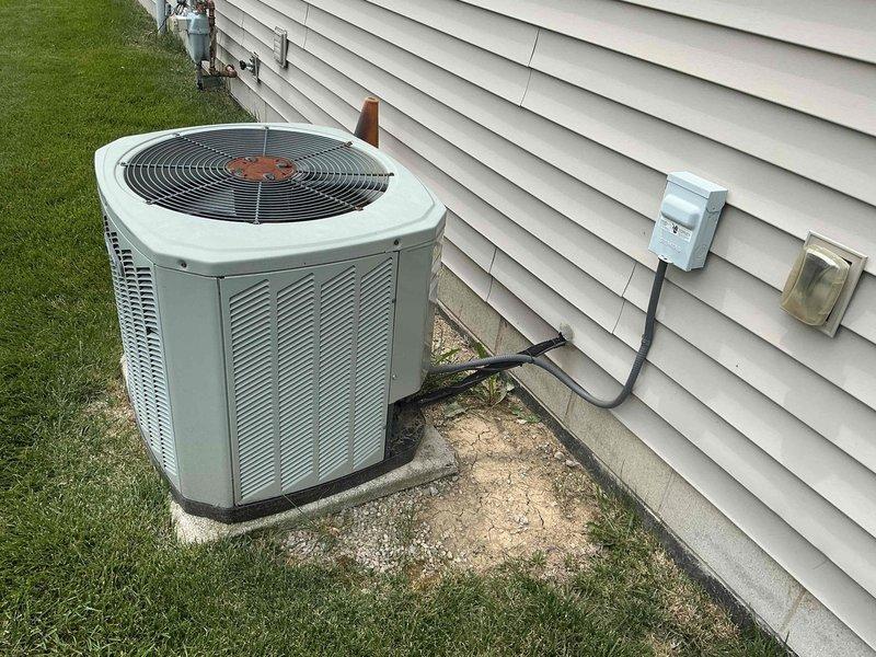 Completed comprehensive tune-up on 15-year-old residential air conditioning system. Performed standard maintenance procedures including inspection of outdoor condenser unit, verification of electrical connections at disconnect box, examination of refrigerant lines and coil assembly, and assessment of internal heat exchanger components. System found to be operational with age-appropriate wear on copper refrigerant lines and fittings noted during inspection.