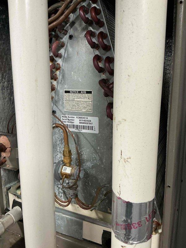 Performed preventive maintenance on air conditioning system with model TCSBA0521A evaporator coil assembly. Conducted visual inspection of heat exchanger coils using borescope camera, confirming proper fin condition and cleanliness. Verified refrigerant line connections and brass valve fittings for secure operation.