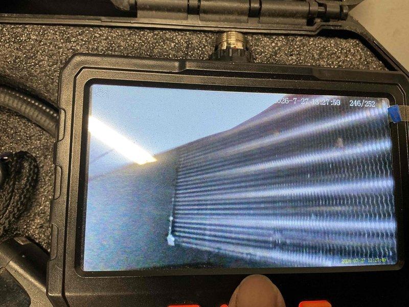 Performed preventive maintenance on air conditioning system with model TCSBA0521A evaporator coil assembly. Conducted visual inspection of heat exchanger coils using borescope camera, confirming proper fin condition and cleanliness. Verified refrigerant line connections and brass valve fittings for secure operation.