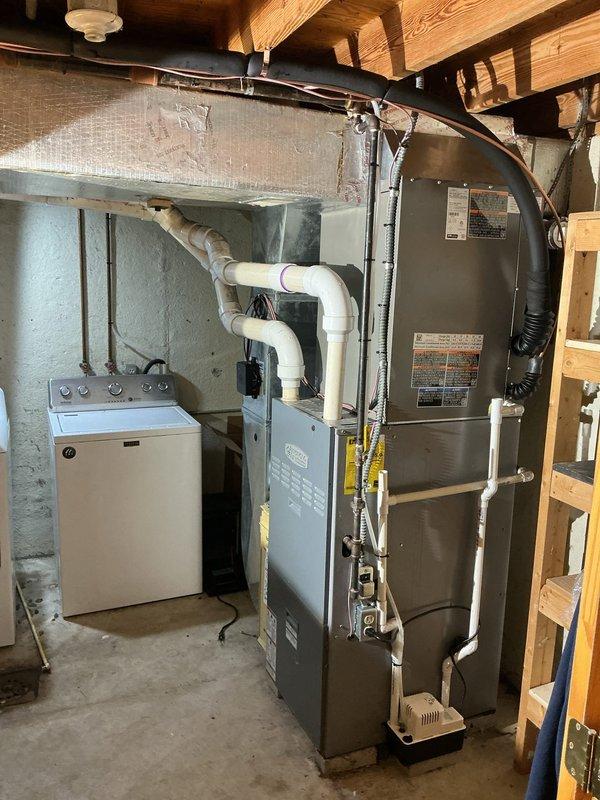Completed full HVAC system installation including a 14 SEER single-stage condenser unit mounted on new equipment pad with disconnect and whip. Installed upflow cased evaporator coil with required sheet metal transitions and new 7/8" x 50' lineset connecting outdoor and indoor components. Replaced existing thermostat with new unit and verified proper system operation, refrigerant charge, and airflow throughout. All equipment covered under 10-year parts and labor warranty.