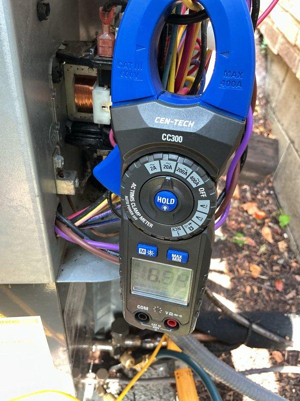 Completed routine cooling maintenance on a 4-year-old air conditioning system during a scheduled service window. Performed electrical diagnostics using clamp meter, measuring compressor amperage at 16.82 amps to verify proper system operation and component performance. Inspected exterior unit components, refrigerant lines, and electrical connections; all systems operating within normal parameters with no immediate repairs required.