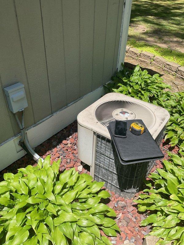 Completed comprehensive HVAC system replacement estimate for residential property. Evaluated existing furnace unit located in basement utility area and outdoor air conditioning condenser unit positioned against exterior wall with landscaping. Assessed current equipment condition, measured system specifications, documented installation environment including ductwork configuration and electrical service connections, and captured detailed photos of both indoor and outdoor components to provide accurate replacement system recommendations and pricing options for complete heating and cooling system upgrade.