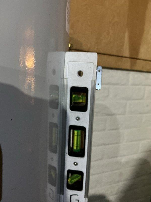 Installed a new 50-gallon residential tanked water heater in the utility area, connecting yellow gas supply lines and white PVC plumbing pipes according to manufacturer specifications and local code requirements. Verified proper level and plumb alignment of the unit and ensured all safety labels and warning stickers remained visible and intact upon completion.