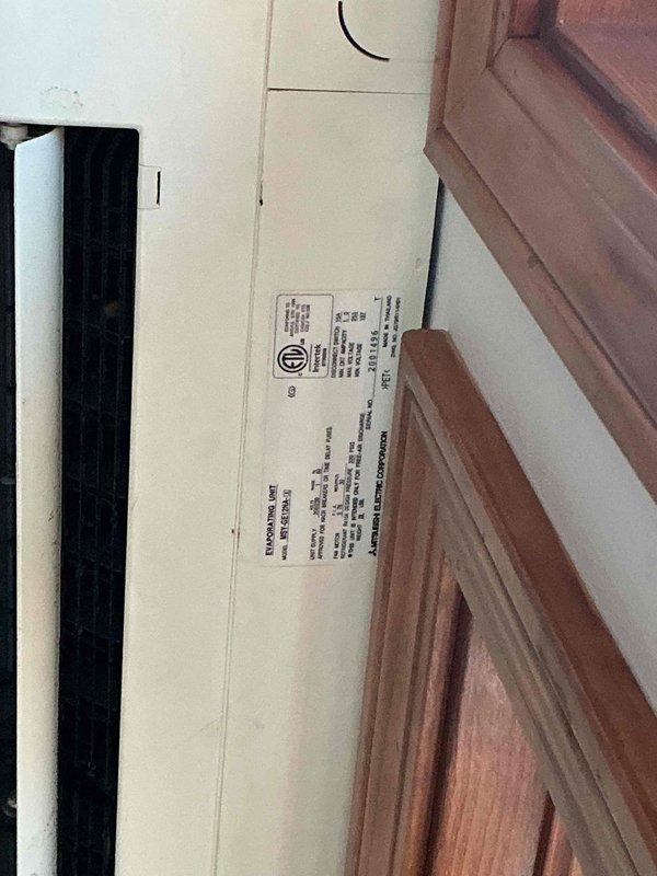 Responded to service call for 10-year-old Mr. Slim mini split system with non-operational outdoor fan in compressor unit. Upon arrival, inspected indoor wall-mounted evaporator unit and outdoor condenser unit to diagnose fan failure. Documented existing equipment installation and system configuration with photos for service records.