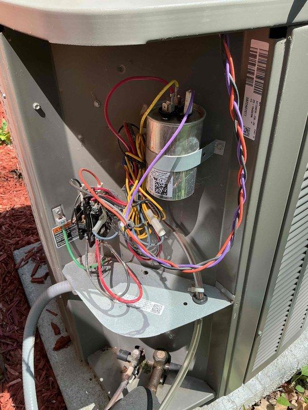 # HVAC Service Completed

Responded to service call for 3-year-old air conditioning unit that was not turning on and producing a clunking noise when operational. Upon arrival, performed diagnostic inspection of outdoor condensing unit. Removed access panel to examine internal electrical and mechanical components.

Conducted thorough visual inspection of contactor, capacitor, and associated wiring connections. Checked contactor operation and examined all wire terminations at relay terminals for signs of arcing, burning, or loose connections. Inspected dual run capacitor for bulging, leaking, or other signs of failure. Verified proper wire routing and connection integrity throughout electrical compartment.

Based on symptoms of intermittent operation and mechanical clunking noise, focused diagnostic efforts on contactor assembly and starting components. Tested electrical connections and component functionality to identify root cause of failure to start condition. Documented findings with