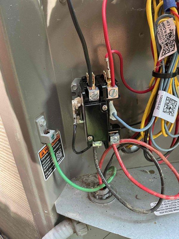 # HVAC Service Completed

Responded to service call for 3-year-old air conditioning unit that was not turning on and producing a clunking noise when operational. Upon arrival, performed diagnostic inspection of outdoor condensing unit. Removed access panel to examine internal electrical and mechanical components.

Conducted thorough visual inspection of contactor, capacitor, and associated wiring connections. Checked contactor operation and examined all wire terminations at relay terminals for signs of arcing, burning, or loose connections. Inspected dual run capacitor for bulging, leaking, or other signs of failure. Verified proper wire routing and connection integrity throughout electrical compartment.

Based on symptoms of intermittent operation and mechanical clunking noise, focused diagnostic efforts on contactor assembly and starting components. Tested electrical connections and component functionality to identify root cause of failure to start condition. Documented findings with