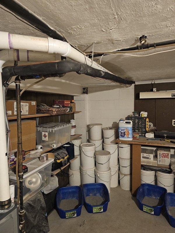 Completed full HVAC system installation in basement utility area, including new air conditioning unit with matching upflow cased coil package. Installed new 3/4" x 30' refrigerant line set with proper insulation and routing. Set new outdoor condenser pad with level placement and positioned unit for optimal airflow and service access. Ran new electrical disconnect and whip to outdoor unit per code requirements. Mounted and wired new thermostat with proper configuration for system operation. All ductwork connections sealed and secured to furnace plenum. Tested system startup, verified proper refrigerant charge, confirmed electrical connections, and ensured all safety controls functioning correctly. System operating within manufacturer specifications with appropriate temperature differential across coil.