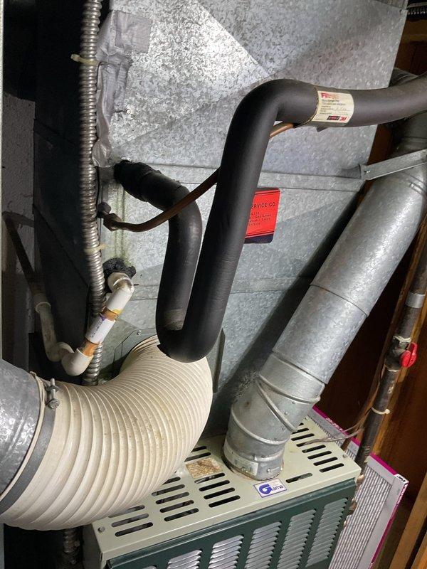 Conducted comprehensive site evaluation for complete HVAC system replacement at residential property. Assessed existing Gibson-branded outdoor condensing unit positioned on concrete pad adjacent to foundation, documenting current equipment condition, placement, and electrical disconnect configuration. Evaluated indoor air handler installation including existing ductwork connections, refrigerant line routing through insulated piping, condensate drainage system, and clearance requirements within mechanical space. Photographed both outdoor and indoor components to document system layout, access points, flexible duct connections, and metal trunk line configuration for accurate equipment sizing and replacement planning. Provided detailed estimate for new system installation including removal of existing equipment, proper disposal, and installation of replacement HVAC system meeting current efficiency standards and building code requirements.