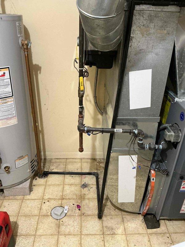 Responded to service call for 13-year-old air conditioning system experiencing water dripping during operation with completely saturated air filter. Upon inspection, found excessive condensate accumulation affecting the system despite recent maintenance performed two weeks prior. Investigated condensate drain system, evaporator coil assembly, and air handler components to identify source of water issue. Assessed airflow restriction caused by saturated filter and examined drain pan and drainage lines for proper function. Addressed condensate management problem and restored system to normal operating condition without water leakage.