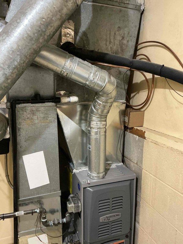 Responded to service call for 13-year-old air conditioning system experiencing water dripping during operation with completely saturated air filter. Upon inspection, found excessive condensate accumulation affecting the system despite recent maintenance performed two weeks prior. Investigated condensate drain system, evaporator coil assembly, and air handler components to identify source of water issue. Assessed airflow restriction caused by saturated filter and examined drain pan and drainage lines for proper function. Addressed condensate management problem and restored system to normal operating condition without water leakage.