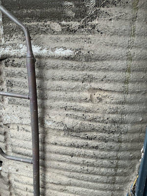 # HVAC Service Completed

Responded to no cooling complaint on 10-year-old residential air conditioning system. Upon inspection, discovered severely restricted airflow due to heavily contaminated evaporator coil with significant dust and debris accumulation throughout the fin surfaces. The coil exhibited extensive frost and ice formation across multiple sections, indicating restricted airflow was causing the coil to freeze during operation.

Found excessive ice buildup on refrigerant lines and ductwork near the air handler, confirming inadequate air circulation across the evaporator coil. The combination of heavy dirt accumulation and resulting ice formation had completely blocked airflow, preventing the system from delivering cool air to the living space.

Documented existing conditions with photographs showing the extent of contamination and frost damage. Recommended immediate coil cleaning and system evaluation to restore proper cooling operation and prevent compressor damage from c