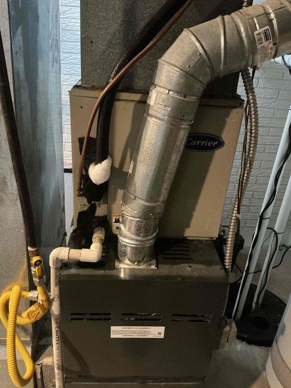 Completed preventative maintenance on 22-year-old air conditioning system. Performed comprehensive inspection of furnace unit, ductwork connections, and exterior condenser grille assembly. Verified proper installation of gas line, PVC drainage piping, and refrigerant lines; confirmed all components operating within normal parameters with no immediate service needs identified.