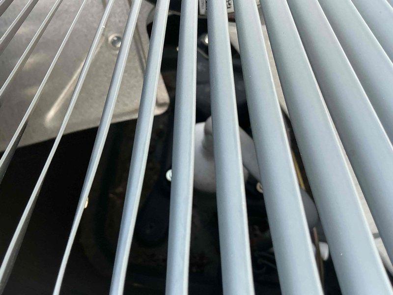 Completed preventative maintenance on 22-year-old air conditioning system. Performed comprehensive inspection of furnace unit, ductwork connections, and exterior condenser grille assembly. Verified proper installation of gas line, PVC drainage piping, and refrigerant lines; confirmed all components operating within normal parameters with no immediate service needs identified.