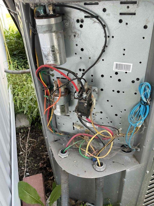 Completed comprehensive tune-up on eight-year-old residential air conditioning system. Performed thorough inspection of outdoor condenser unit, checked electrical connections at capacitor and contactor, verified proper wire terminations, and confirmed all components operating within normal parameters. System tested and found to be functioning properly with no deficiencies noted.