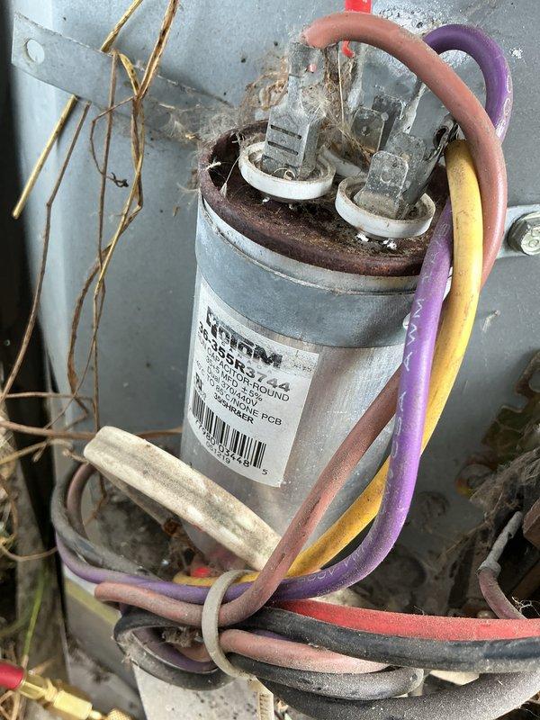 # HVAC Service Call - No Cooling Issue

Responded to service call for 15-year-old air conditioning system not blowing cool air. Upon inspection of the outdoor condenser unit, identified failed capacitor as primary cause of cooling failure. Capacitor showed significant corrosion on terminal connections and exhibited signs of age-related deterioration. Replaced defective capacitor with new unit rated to manufacturer specifications. Verified all electrical connections, tested system operation, and confirmed proper cooling function restored. Unit returned to normal operating condition.